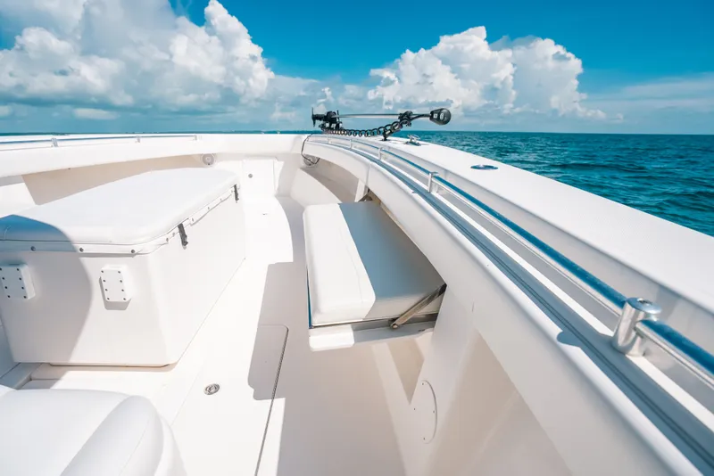 Slide: The Image of 2013 Invincible 42 Open Fisherman boat on open sea under blue sky. - 50