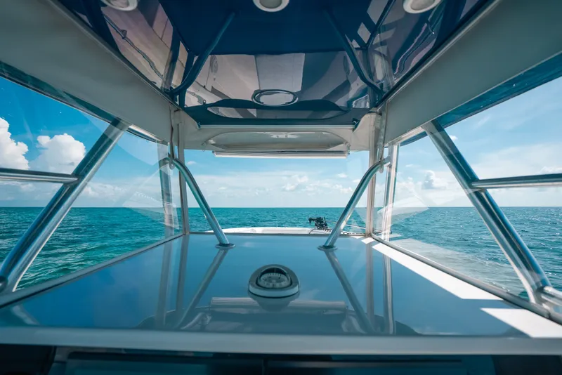 Slide: The Image of Invincible 42 Open Fisherman 2013 boat on open sea, clear sky view. - 37