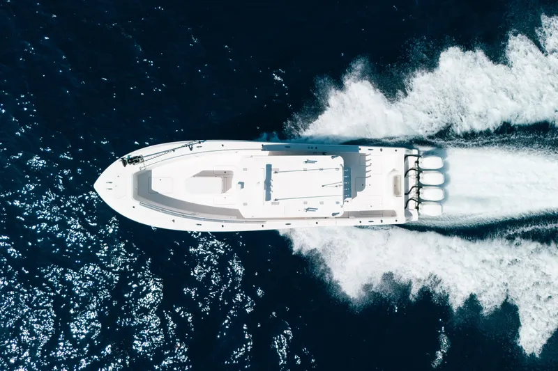 Slide: The Image of Aerial view of 2013 Invincible 42 Open Fisherman speeding on ocean waters. - 18