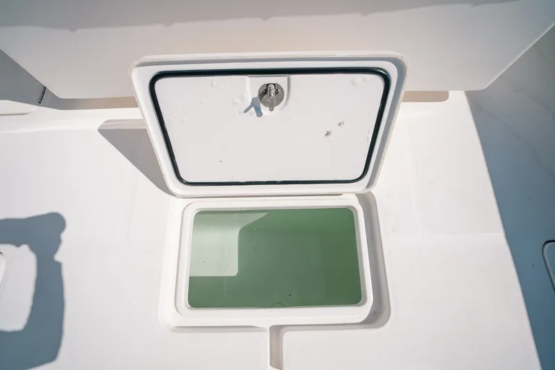 Slide: The Image of Open hatch on 2013 Invincible 42 Open Fisherman boat deck. - 46