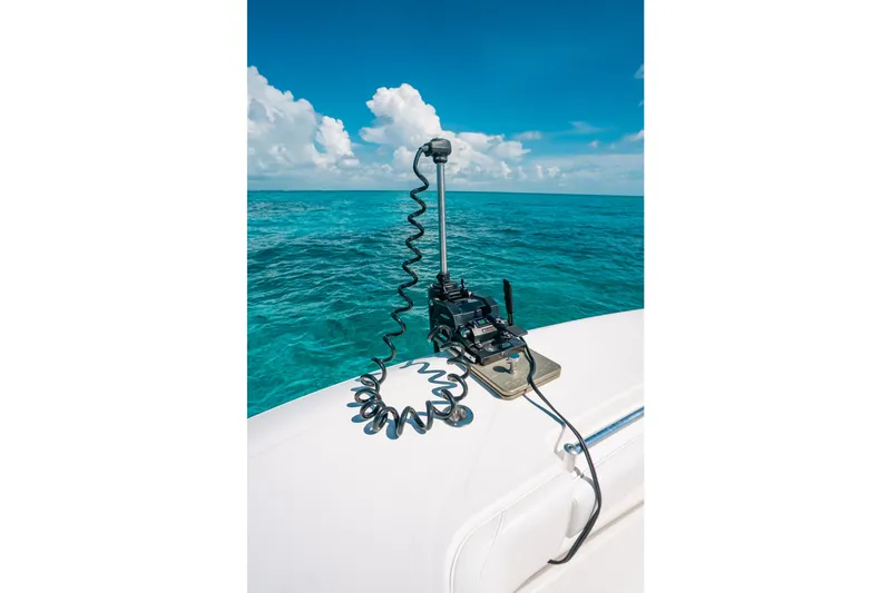Slide: The Image of 2013 Invincible 42 Open Fisherman with marine equipment on deck, ocean backdrop. - 52
