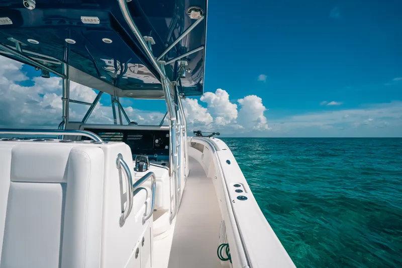 Slide: The Image of Invincible 42 Open Fisherman boat cruising on clear blue ocean, 2013 model. - 48