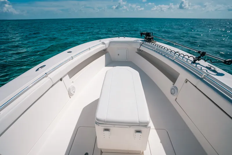 Slide: The Image of 2013 Invincible 42 Open Fisherman boat on calm ocean waters. - 21