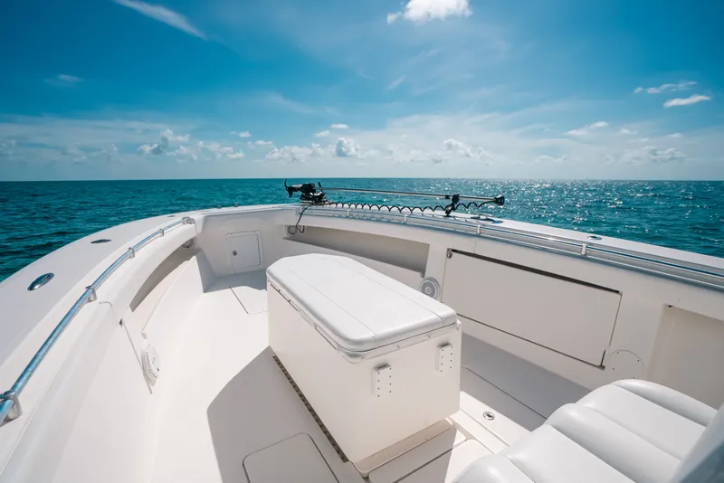 Slide: The Image of 2013 Invincible 42 Open Fisherman boat on open sea under clear blue sky. - 20