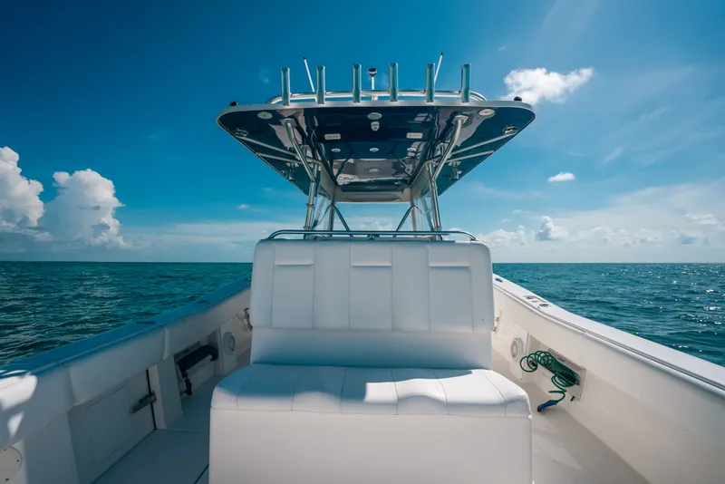 Slide: The Image of Invincible 42 Open Fisherman 2013 boat on open sea under clear blue sky. - 41