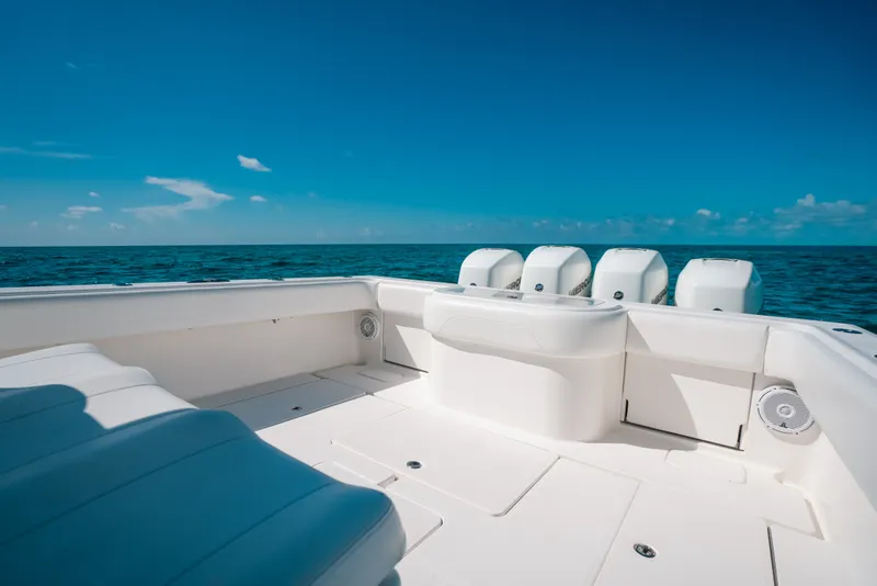Slide: The Image of 2013 Invincible 42 Open Fisherman boat on open sea under clear blue sky. - 39