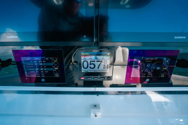 Slide: The Image of Dashboard of a 2013 Invincible 42 Open Fisherman with Garmin displays. - 35