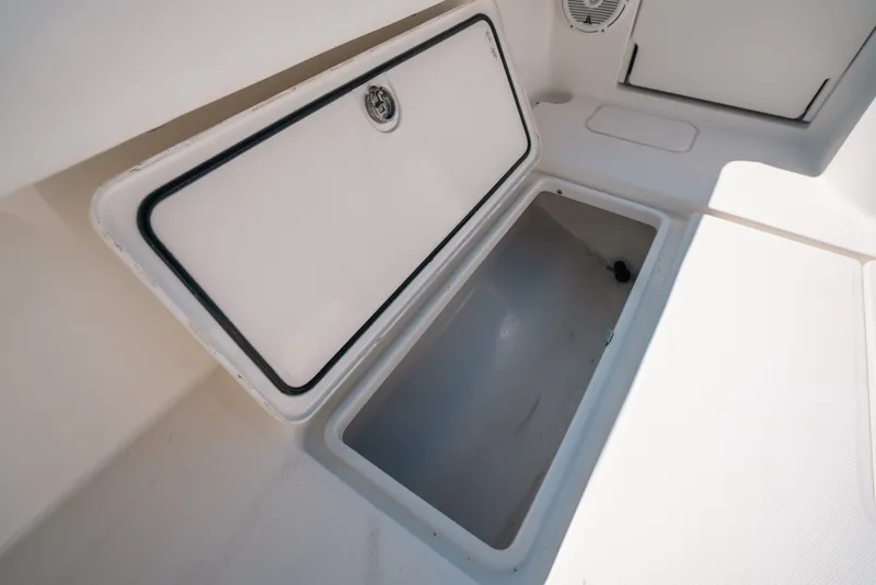Slide: The Image of Open storage compartment on 2013 Invincible 42 Open Fisherman boat. - 47