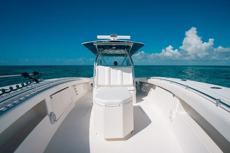 Slide: The Image of 2013 Invincible 42 Open Fisherman boat on open sea under clear blue sky. - 24