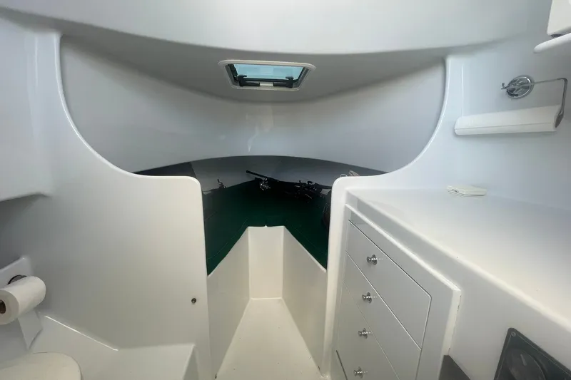 Slide: The Image of 2009 L&H 33 Walkaround cabin interior with storage drawers and a small window. - 15