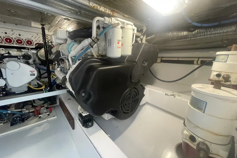 Slide: The Image of Engine room of 2009 L&H 33 Walkaround boat, showcasing mechanical components and systems. - 20