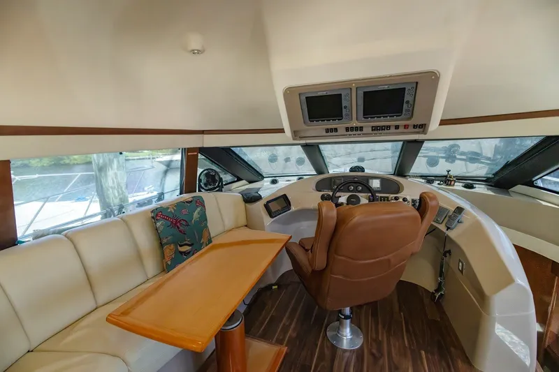 Slide: The Image of Interior of 2007 Carver 56 Voyager SE yacht with helm, seating, and navigation equipment. - 24
