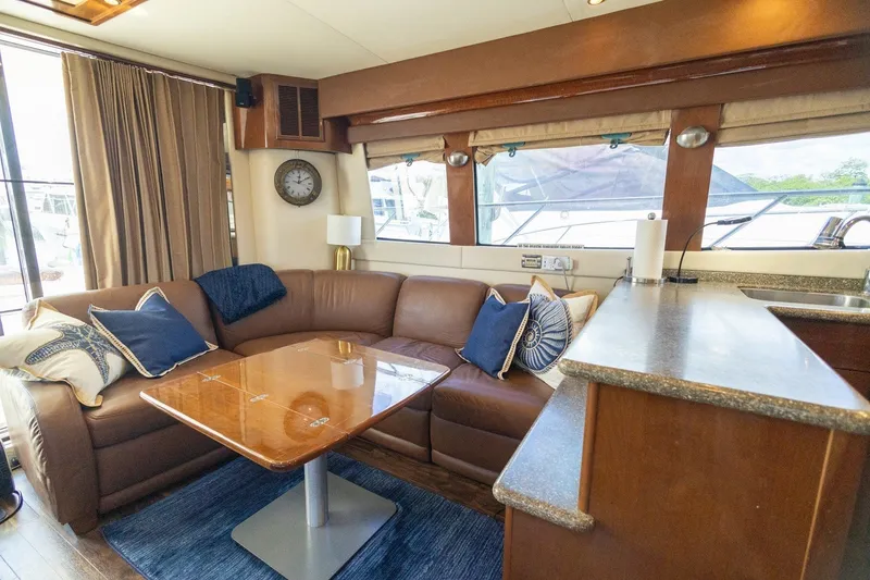 Slide: The Image of Luxurious interior of 2007 Carver 56 Voyager SE yacht with plush seating and elegant decor. - 12