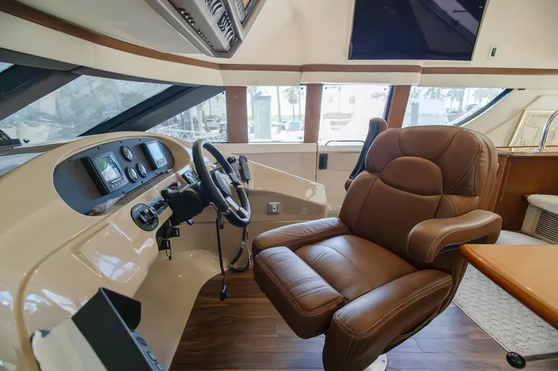 Slide: The Image of Luxurious helm of 2007 Carver 56 Voyager SE yacht with leather captain's chair. - 23