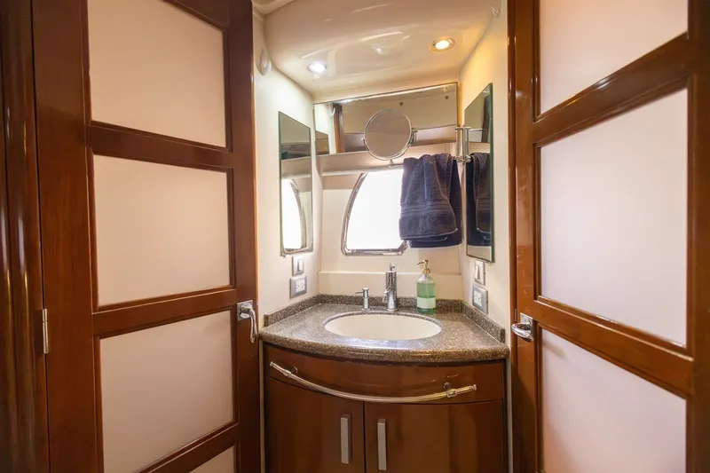 Slide: The Image of Luxurious bathroom interior of 2007 Carver 56 Voyager SE yacht with elegant wood finishes. - 30