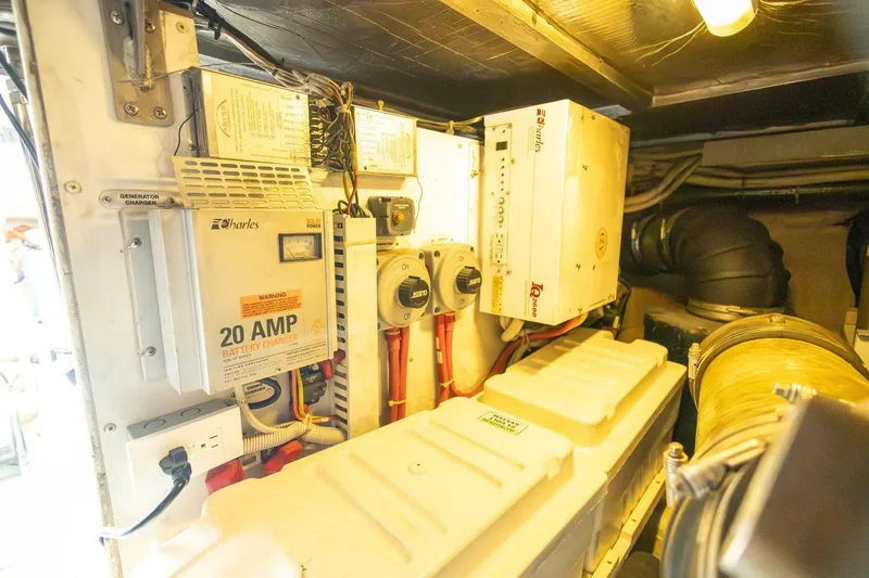Slide: The Image of Engine room of 2007 Carver 56 Voyager SE with battery charger and electrical components. - 43