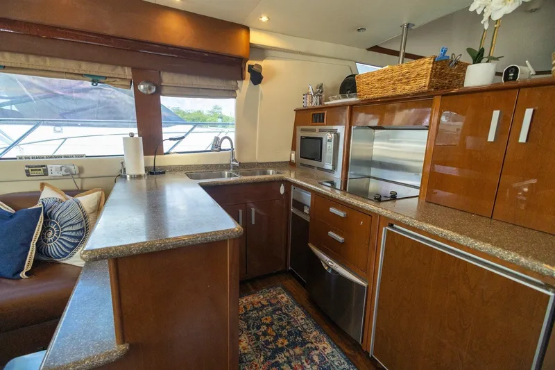 Slide: The Image of Luxurious kitchen interior of 2007 Carver 56 Voyager SE yacht with modern appliances. - 13