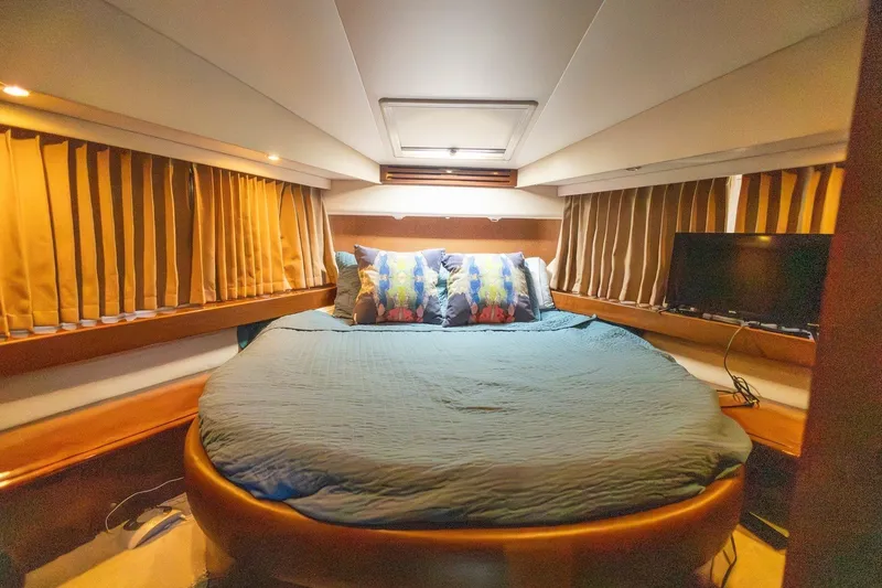 Slide: The Image of Luxurious bedroom interior of 2007 Carver 56 Voyager SE yacht with cozy bedding. - 33
