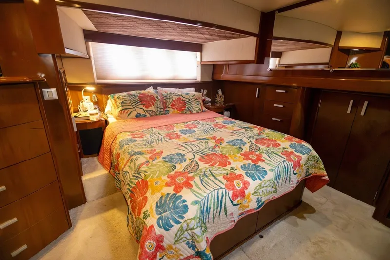 Slide: The Image of Luxurious bedroom interior of 2007 Carver 56 Voyager SE yacht with floral bedding. - 27