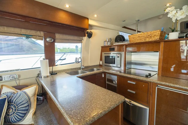 Slide: The Image of Luxurious kitchen interior of 2007 Carver 56 Voyager SE yacht with modern appliances. - 11