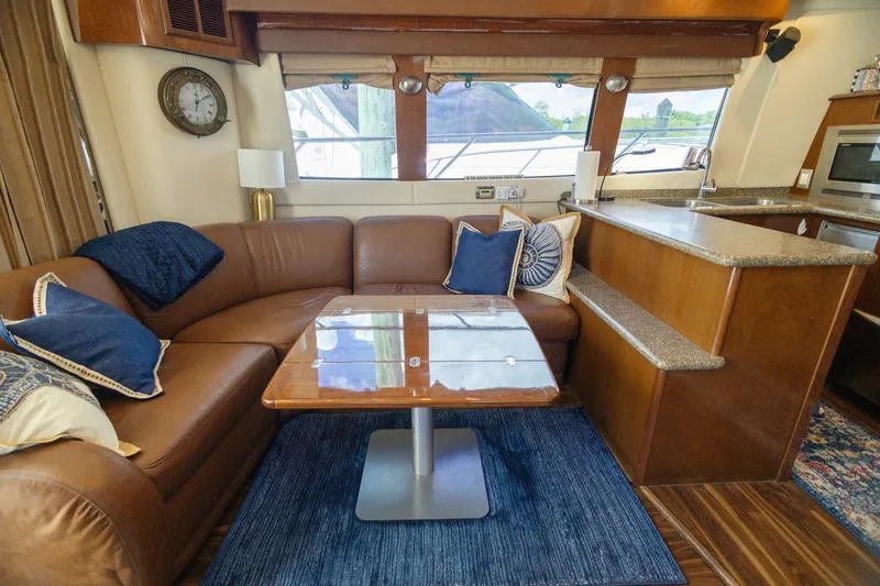 Slide: The Image of Luxurious interior of 2007 Carver 56 Voyager SE yacht with leather seating and modern kitchen. - 10