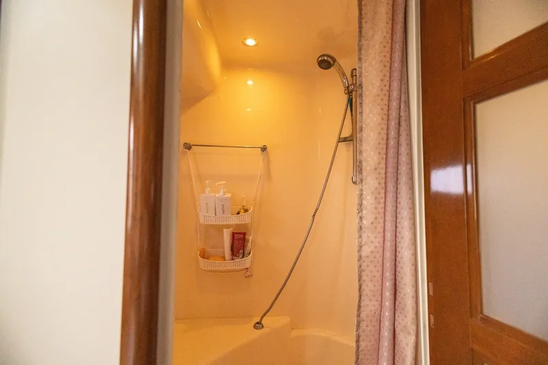 Slide: The Image of Shower area in 2007 Carver 56 Voyager SE yacht with curtain and toiletries. - 31