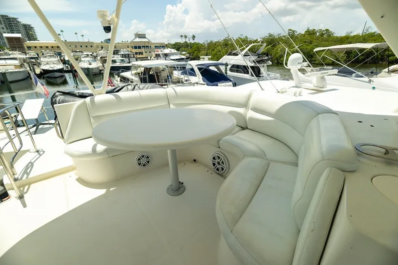 Slide: The Image of Luxurious seating area on 2007 Carver 56 Voyager SE yacht, docked at marina. - 41
