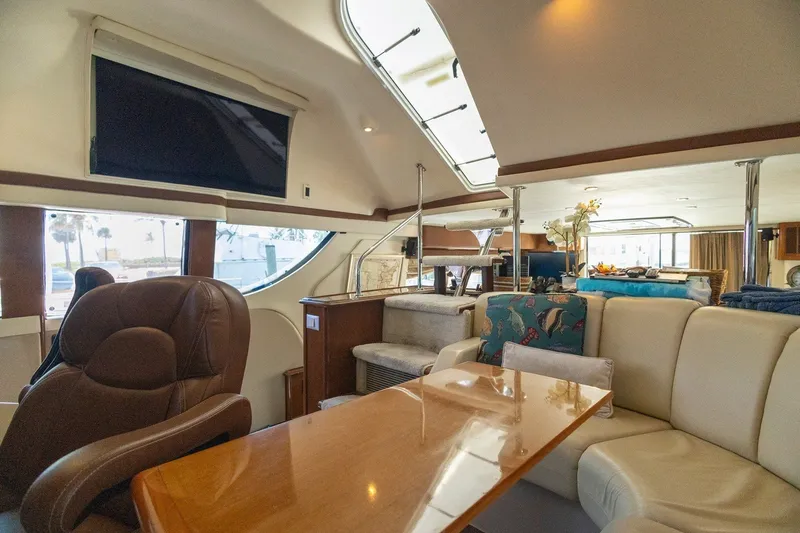 Slide: The Image of Luxurious interior of 2007 Carver 56 Voyager SE yacht with plush seating and elegant decor. - 22