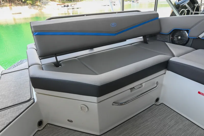Slide: The Image of 2022 Cobalt R8 Surf boat interior with sleek gray seating and blue accents. - 18