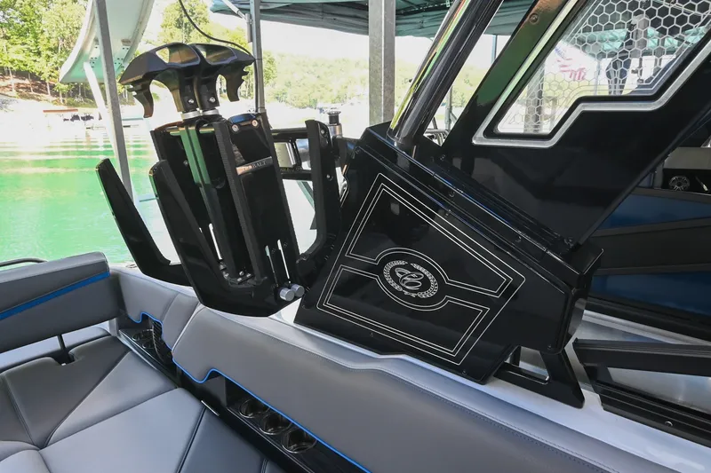 Slide: The Image of 2022 Cobalt R8 Surf boat interior with sleek seating and advanced wakeboard rack. - 24