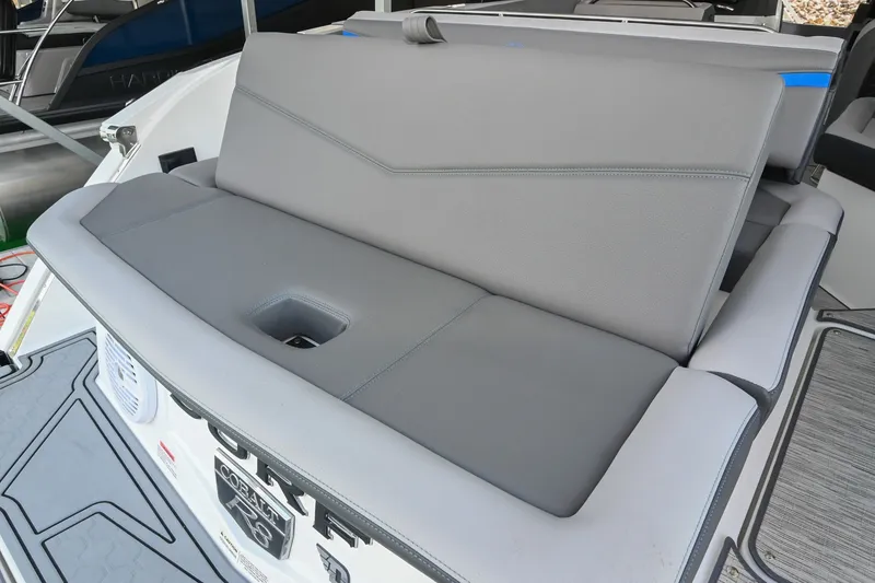 Slide: The Image of 2022 Cobalt R8 Surf boat with sleek gray seating and modern design. - 11