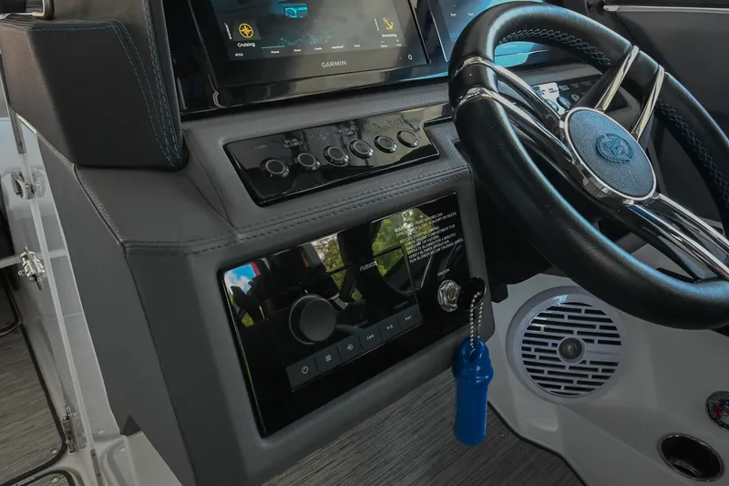 Slide: The Image of 2022 Cobalt R8 Surf boat dashboard with steering wheel and control panel. - 35