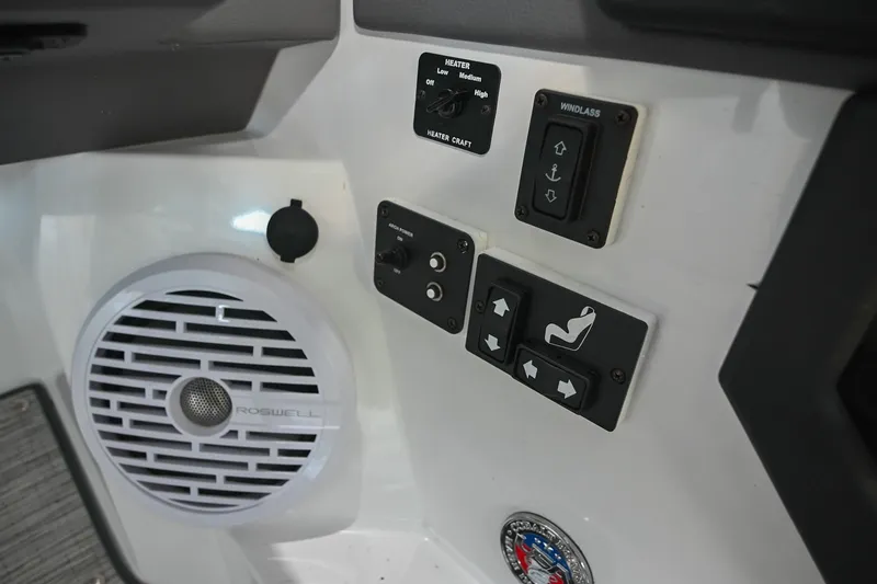 Slide: The Image of Control panel of 2022 Cobalt R8 Surf boat with speaker and switches. - 39