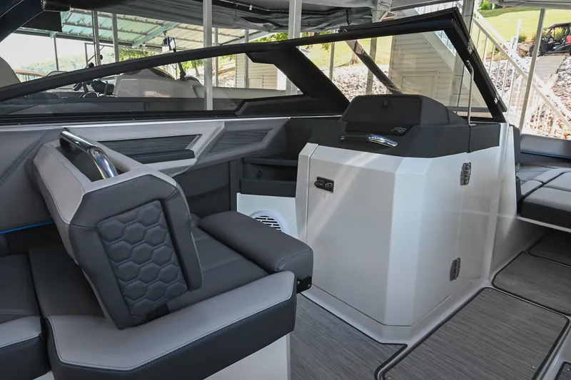 Slide: The Image of 2022 Cobalt R8 Surf boat interior with modern seating and sleek dashboard design. - 28