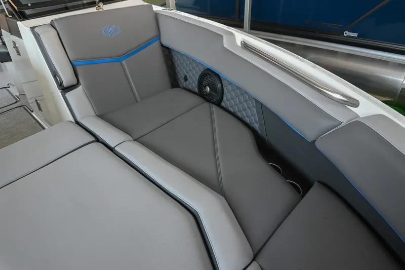 Slide: The Image of 2022 Cobalt R8 Surf boat interior with gray seating and blue accents. - 47