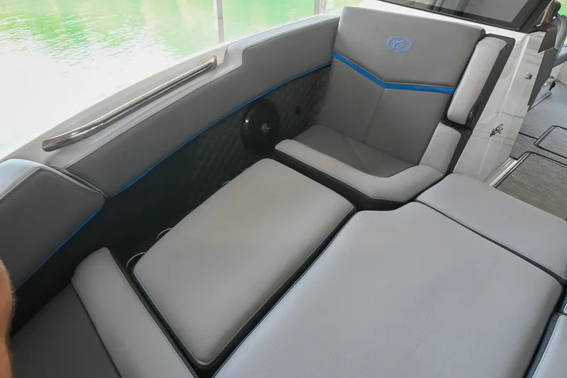 Slide: The Image of 2022 Cobalt R8 Surf boat interior with luxurious gray seating and blue accents. - 46