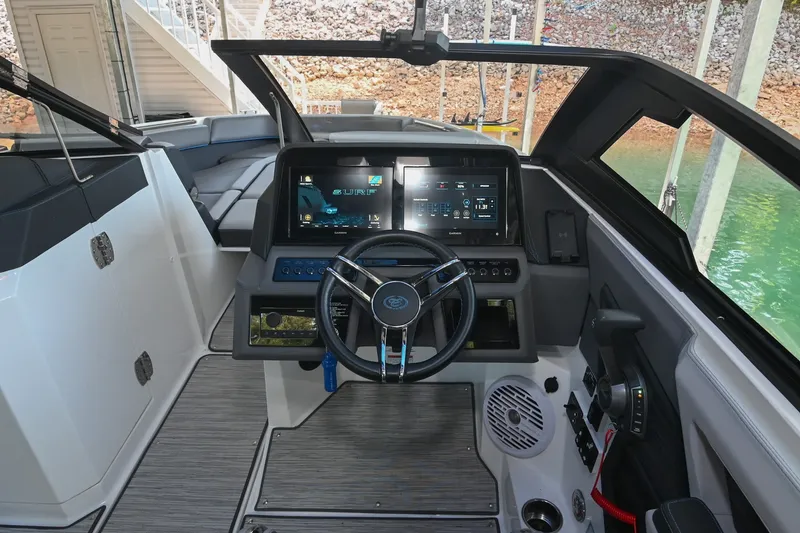 Slide: The Image of 2022 Cobalt R8 Surf boat cockpit with modern dashboard and steering wheel. - 34