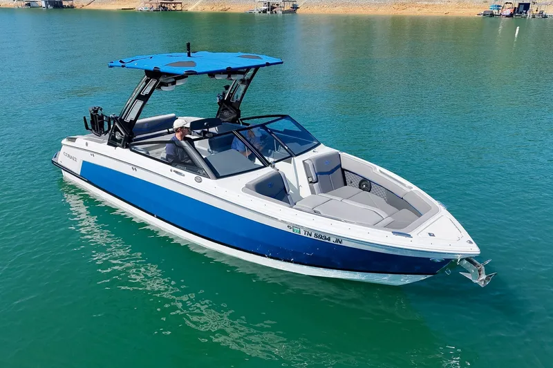 Slide: The Image of 2022 Cobalt R8 Surf boat on clear blue water, featuring sleek design and modern amenities. - 13