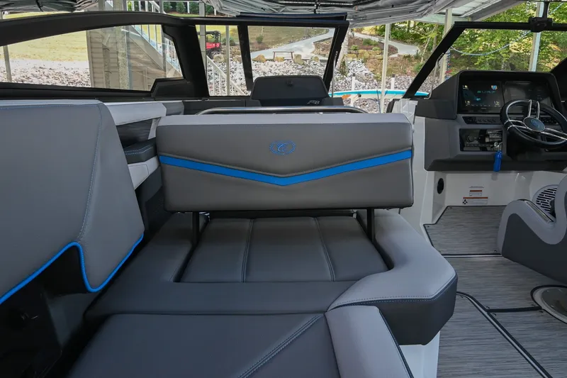 Slide: The Image of Interior of 2022 Cobalt R8 Surf boat with modern seating and dashboard. - 23