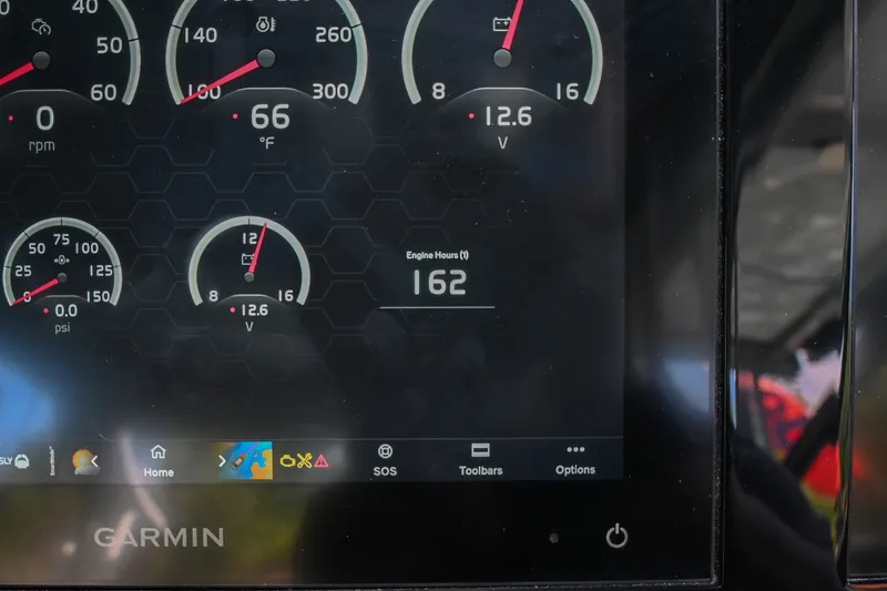 Slide: The Image of Garmin display showing engine metrics on a 2022 Cobalt R8 Surf boat. - 38