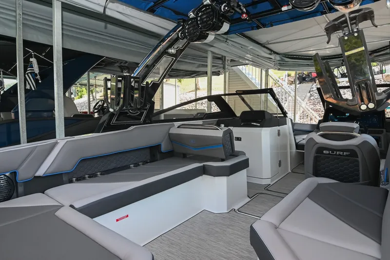 Slide: The Image of Luxurious interior of a 2022 Cobalt R8 Surf boat with modern seating and sleek design. - 16