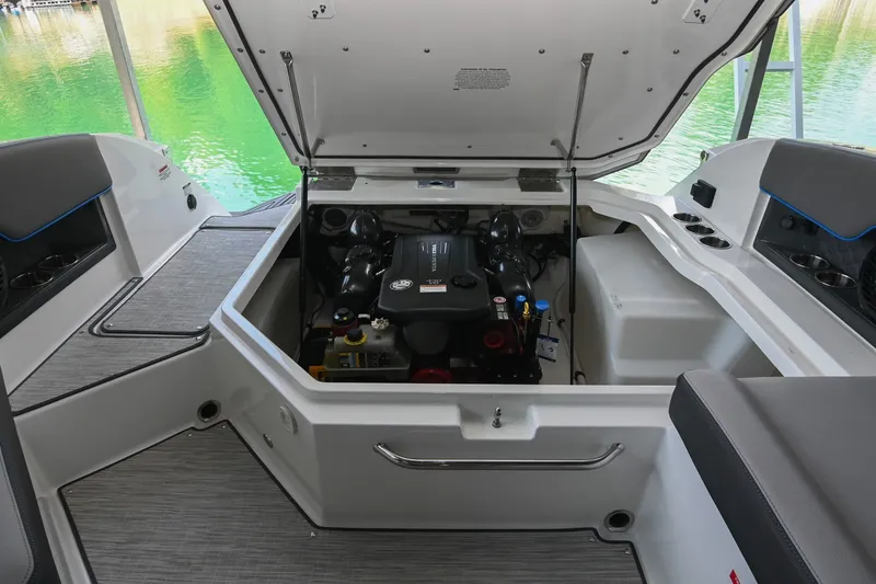Slide: The Image of 2022 Cobalt R8 Surf boat engine compartment with open hatch, showcasing interior details. - 51