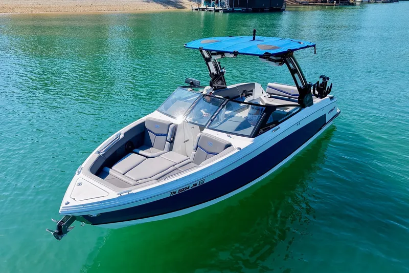 Slide: The Image of 2022 Cobalt R8 Surf boat on clear water, featuring sleek design and modern amenities. - 17