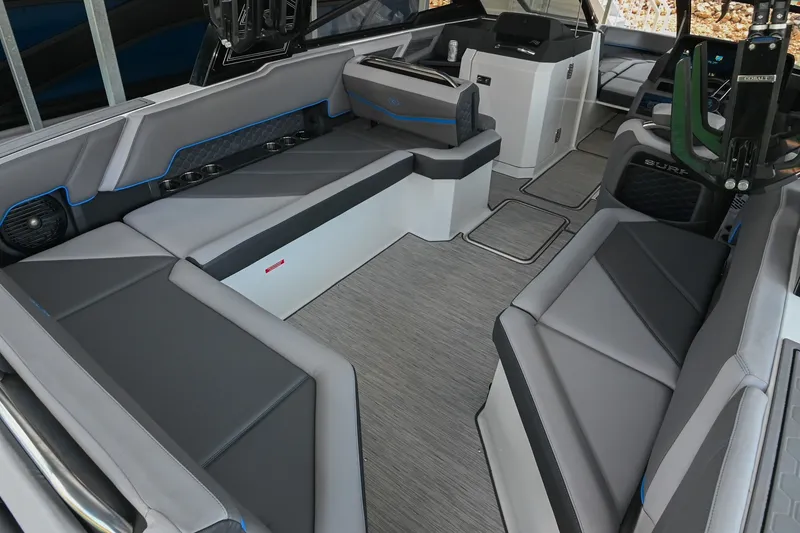 Slide: The Image of 2022 Cobalt R8 Surf boat interior with sleek gray seating and modern design. - 13