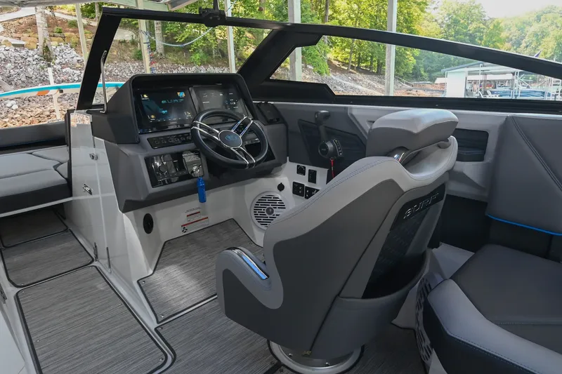 Slide: The Image of 2022 Cobalt R8 Surf boat interior with modern dashboard and steering wheel. - 32