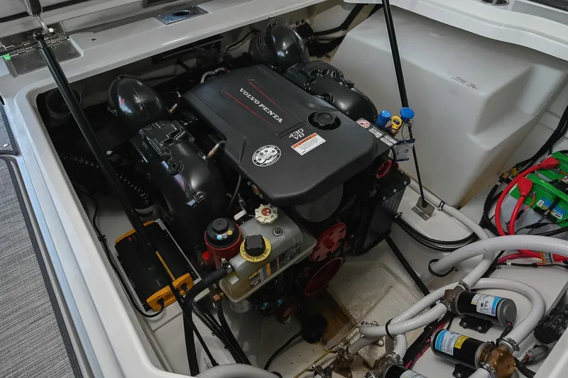 Slide: The Image of Engine compartment of a 2022 Cobalt R8 Surf boat featuring a Volvo Penta engine. - 50
