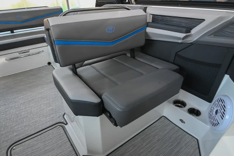 Slide: The Image of 2022 Cobalt R8 Surf boat interior with gray seating and blue accents. - 29