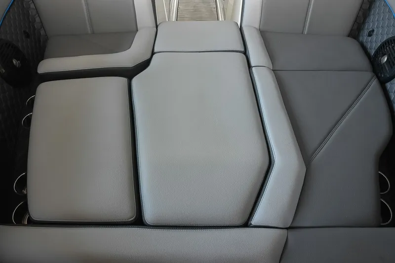 Slide: The Image of 2022 Cobalt R8 Surf boat interior with sleek, modern gray seating design. - 48