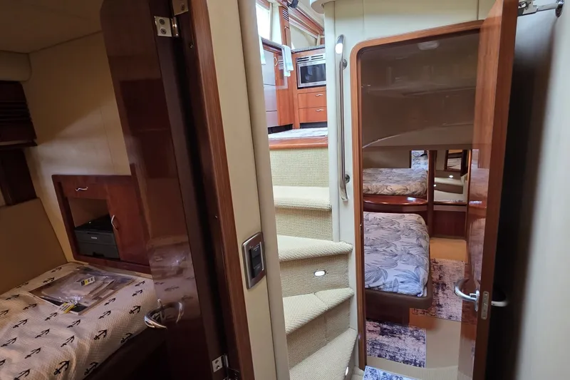Slide: The Image of Interior of 2005 Sea Ray 550 Sedan Bridge yacht with cozy cabins and elegant wood finishes. - 55