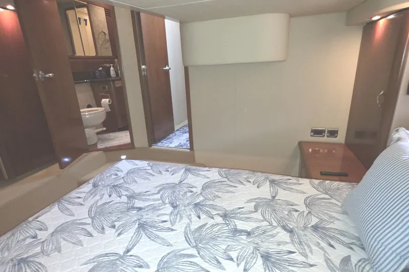 Slide: The Image of Interior of 2005 Sea Ray 550 Sedan Bridge yacht bedroom with ensuite bathroom. - 44